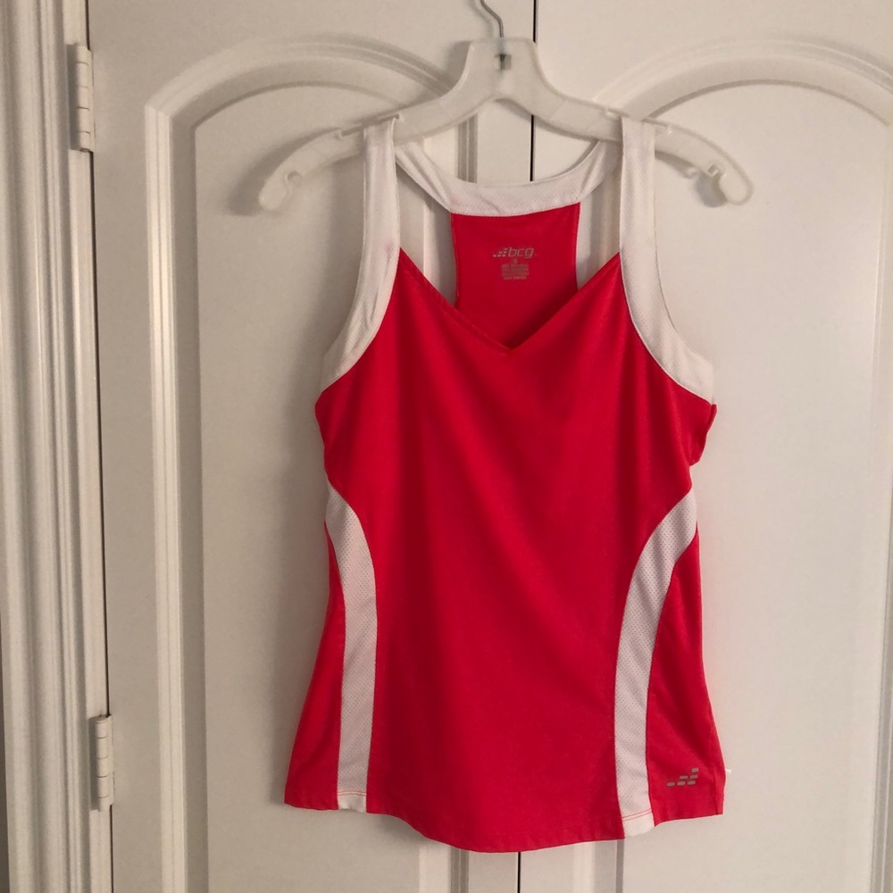 Bright athletic top. Neon pink with white trim . Size S.